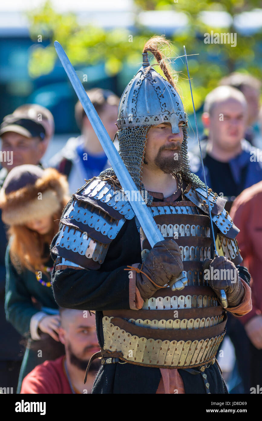 Swordsman in armor at the festival `Legends of the Norwegian Vikings` on City Day Stock Photo